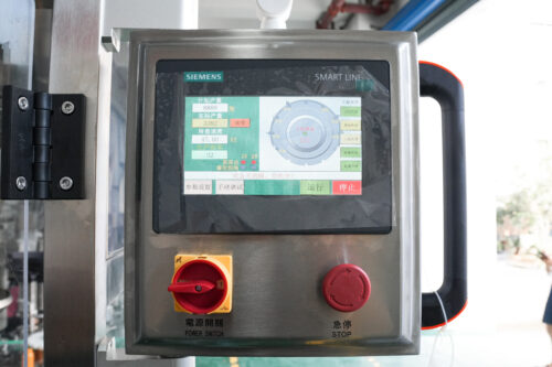 Touchscreen interface showing English operation screen.