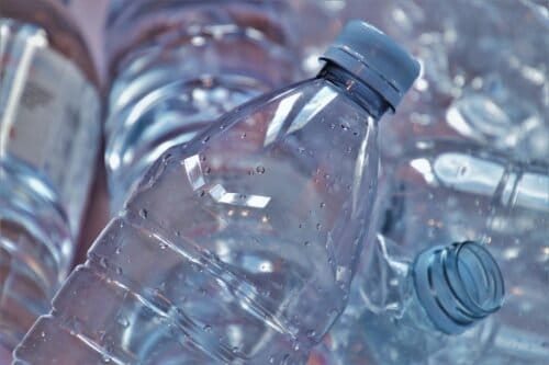 Mineral water bottles usually use PET (polyethylene terephthalate) instead of PVC.