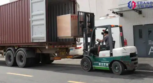 Forklift driver is loading wooden boxes carefully