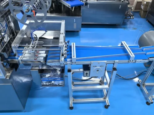 Robotic arm removes slab conveyor belt